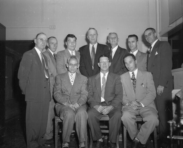 Group portrait of ten officials of the Madison Painters Union, Local 802, as they plan their union's 50th Anniversary.