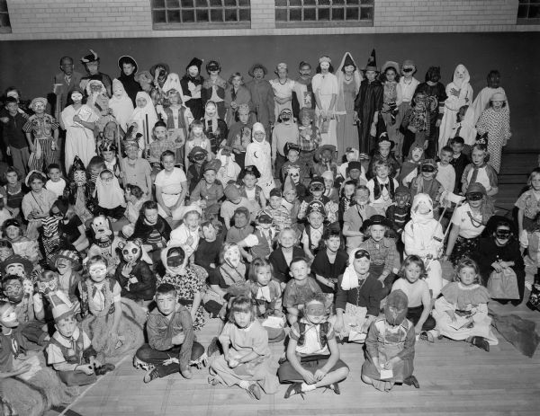 1,250 Lapham School students and parents dressed in Halloween costumes attended an evening Halloween party at the school sponsored by the Parent Teachers Association (PTA).