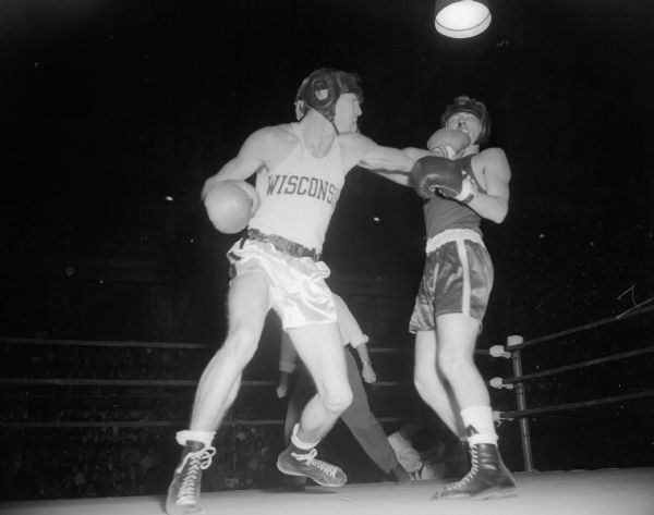 UW boxer Lavern Lewison punches Robert Judson, a contender from Chicago. Lewison won the first championship in the finals of the Tournament of Contenders.