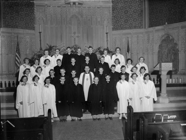 Group portrait of thirty-nine members of the Luther Memorial confirmation class.  Reverend Charles A. Puls is pastor of the church.