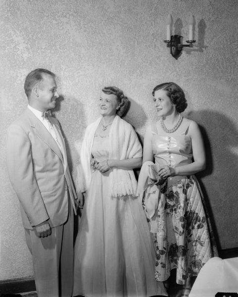 Fred R. Zimmerman, Leona (Mrs. Fred) Zimmerman, and Genevieve Busse, left to right, chat at the Cosmos Dance Club's 30th anniversary dinner dance held at the Nakoma Country Club.