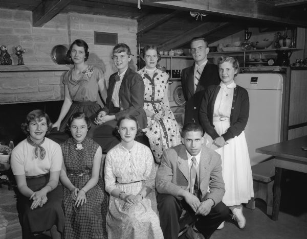 Group portrait of teenagers serving on the committee for the Maple Bluff Country Club's dance for high school students. Front row, left to right: Virginia Eierman, Marilyn Butler, Ruth Charlton, and Michael Murphy. Back row: Elizabeth Marshall, Patricia Moran, Dorothy Marling, Thomas Farley and Anne Vilas.