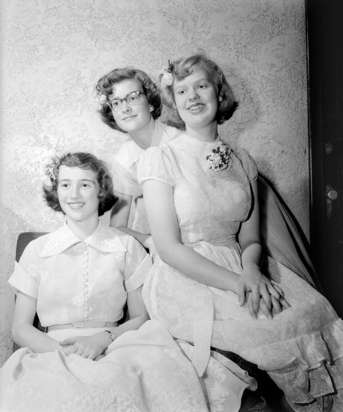 Portrait of three 13-year old Nakoma graduates at a party at Nakoma Country Club. Left to right: Connie Platz, Kay La Court, Mari Brown.
