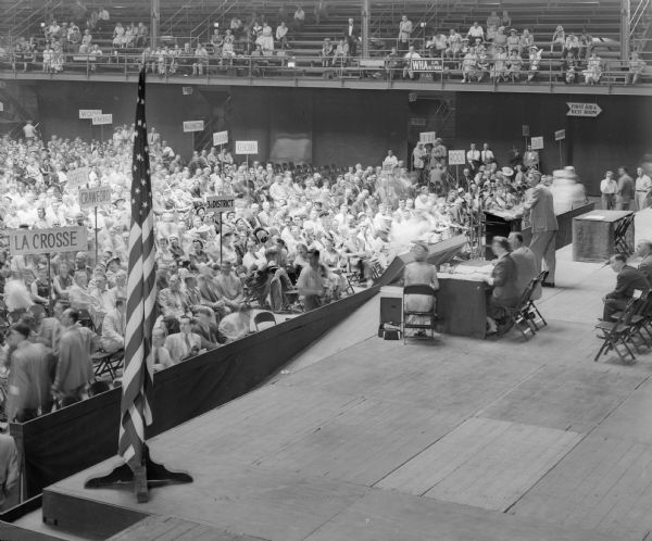 One of three views providing a panoramic view of the Wisconsin Republican Party Convention at the University of Wisconsin-Madison Field House. This far right view shows Chairman Wayne Hood preparing to call for order.