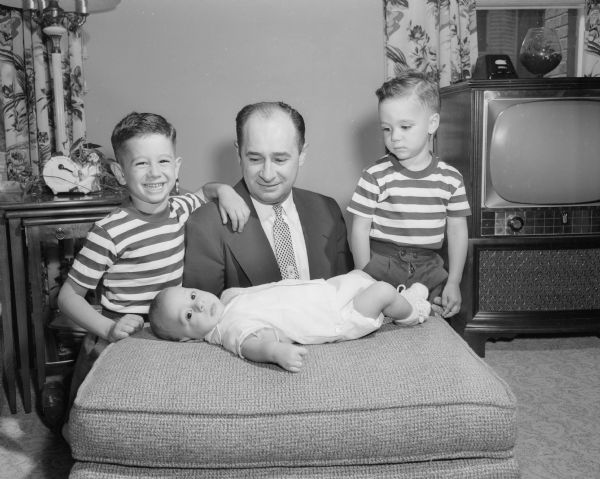 A photographic tribute to Madison dads on Fathers Day includes a photograph of Dr. James J. Nania, a dentist, with his three sons John Nania, James Nania, and Jeffrey Nania. They are preparing for a vacation at a northern resort.