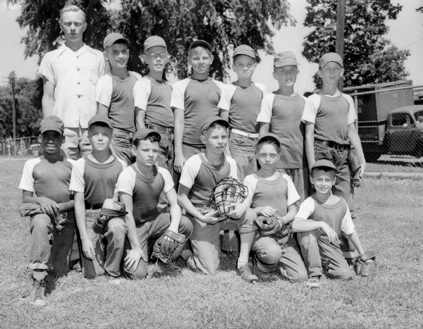 Group portrait of the Piggly Wiggly "midget" baseball team.

