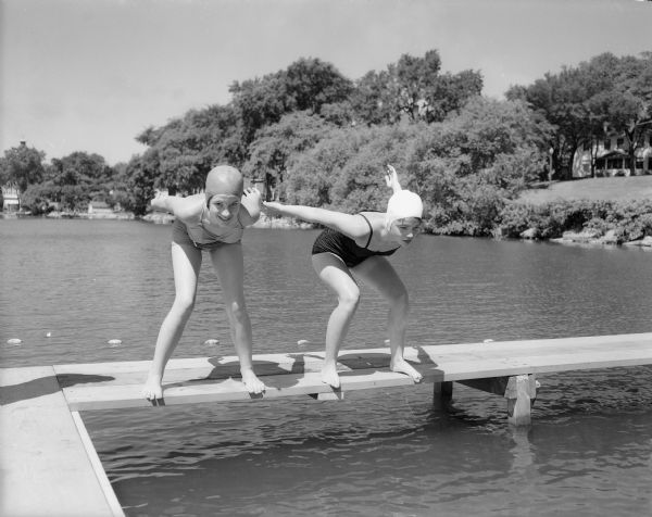 Anne Fakler, left, and Nancy Wynn poise for a practice swim during the city swim meet at B.B. Clarke beach on Lake Monona.