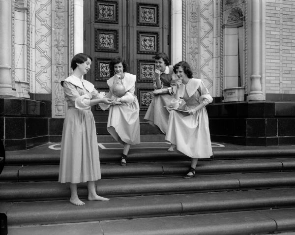 Three members of the Edgewood High School 1953 graduating class performing "Youth is A Journey" on the steps of the school. Left to right are: Mary Durfee, Jo Ann Kehl, Marilyn Lathers and Jo Jean Kehl.