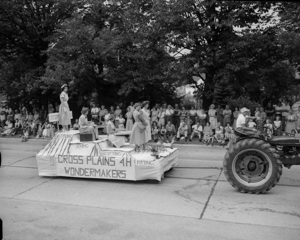 Pictured on the float in a parade celebrating the 100th anniversary of St. Francis Xavier Catholic Church in Cross Plains is a group of men and women garbed in century-old clothing deeding the the land on which the church stands.