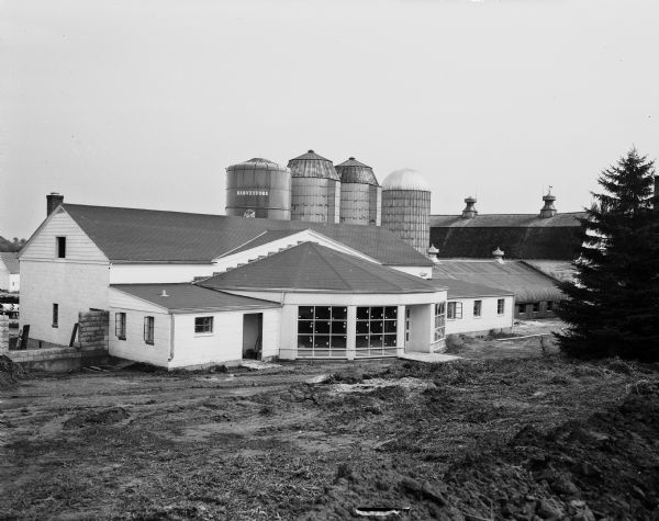 Exterior view of the Bowman Dairy Farm circular milking parlor building.