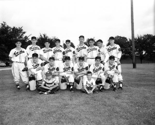 The baseball team of Waunakee Civic Club is shown with manager Vern Hackbart and bat boys.