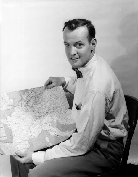 Arthur Constable displays the route of his 10-month travel route through Europe and North Africa on a map.