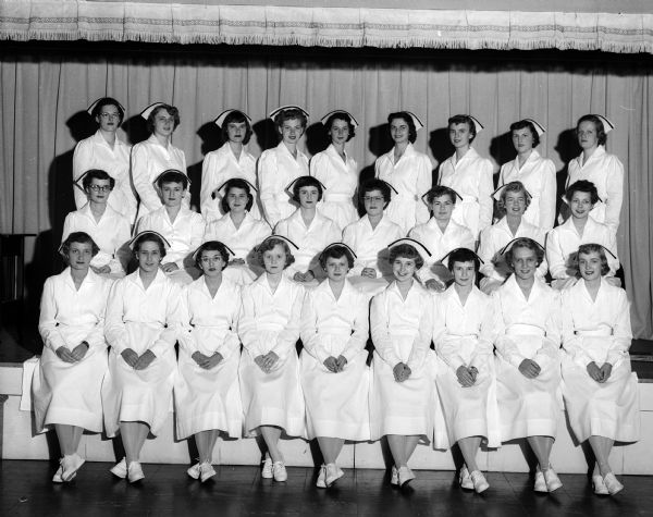 Class portrait of 26 women who graduated from the Madison General Hospital School of Nursing.