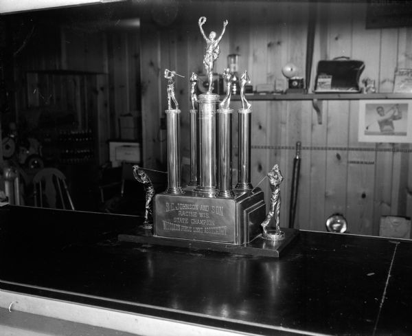 The golf trophy to be awarded to the state champion of the Wisconsin Public Links state golf tournament stands on display.