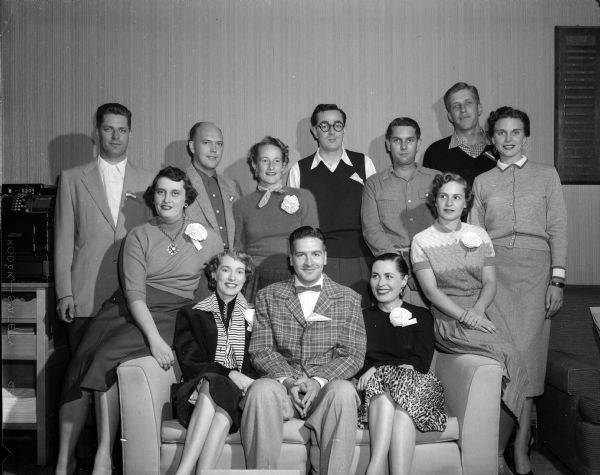 Group portrait of the directors of the Combo Club, a dance group of young Madison couples. Front row, left to right: Mrs. Donald May, Mrs. Harley Thronson, Mr. Thronson, Mrs. Pat Hernon, and Mrs. James Severson. Back row, left to right: Donald May, Dr. and Mrs. William Tanner, Pat Hernon, James Severson, and Mr. and Mrs. Richard Stark.