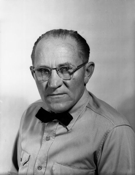 Portrait of Elmer Gloege used for an advertisement of the Elmer Gloege Shell Service Station, 2801 University Avenue.