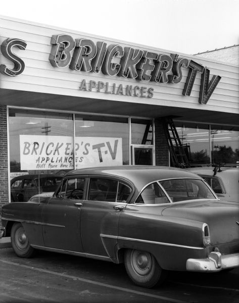 Exterior of Brickner's Applinaces & TV at the new Madison East Shopping Center on East Washington Avenue, with a car parked in front.