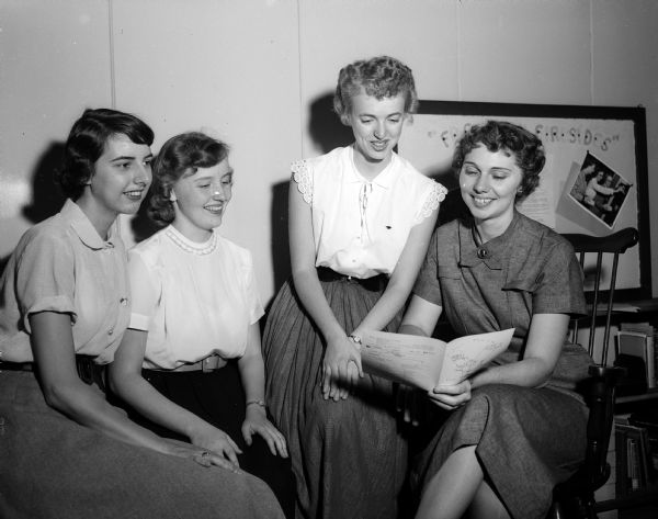 Donna Jones (right), student director of the YWCA at the University of Wisconsin, is shown with three student leaders of the YWCA: Martha Stone, Patricia Cleasby, and Elsa Splett.