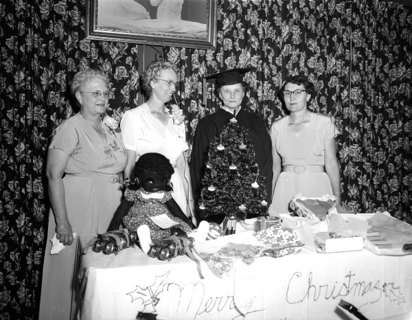 An annual Christmas party in October sponsored by the Women of the Moose was held at the Moose House to show members the gifts to be shipped to Mooseheart and Moosehaven for distribution at the holiday season. Pictured left to right are: Mornelda Kleinheinz, chairman of the Moosehaven committee; Clara Sheets, senior regent; Agnes Prohaska of West Bend, one of the newly-appointed deputy grand regents in Wisconsin and Alma Raemisch, chairman of the Mooseheart committee.