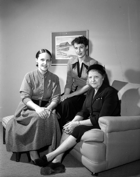 Group portrait of three women in charge of planning the Madison Junior Chamber of Commerce membership auxiliary tea on October 13, 1953. They are, from left: Corrine Van Sickle, Mrs. Vern Smith of the Jaycettes, and Rosa Fred, wife of the President of the University of Wisconsin, who will be the hostess at the tea at the Olin House located at 130 North Prospect Avenue. Assisting Rosa Fred will be the Board of Directors of the Jaycettes. Corrine Van Sickle, Patricia Reese, Eileen Teifert, Barbara May, Harriet Coyne, Katherine Kampen, Kathryn McGuire, Ann Cleary, Louise Frye, and Lucille Genn. Pouring at the tea will be Rosa Fred, Corrine Van Sickle, and Mrs. F.D. Kohn.