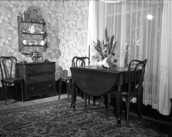 A dining set standing inside the dining room in the apartment of John and Marilyn Knutson.