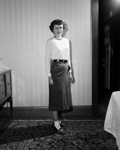 Ethel Miller models a skirt made by her mother, Elizabeth (Mrs. Howard C.) Miller. The photograph was taken to accompany an article in the <i>Wisconsin State Journal</i> about Elizabeth's seamstress work for herself and her daughter.