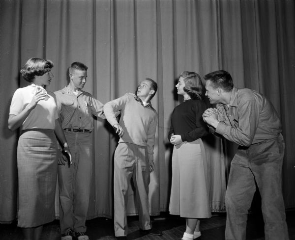 Students acting out a scene in East High School's fall play, "A Connecticut Yankee in King Arthur's Court."  Left to right:  Mary Levenick, Roger Alexander, John Spaeni, Madonna Cammack, and Ronnie Hansen.