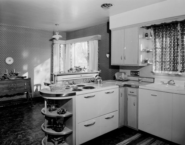 Interior view of the kitchen and dining room in the residence of Leo Scheberle.