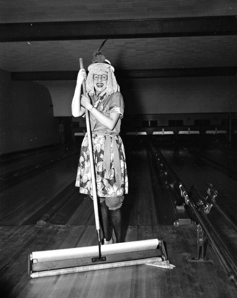 The Business Women's Bowling League staged its first annual dress up bowling sessions at the Plaza Alleys. Ad Colvin dresses as a mophead.