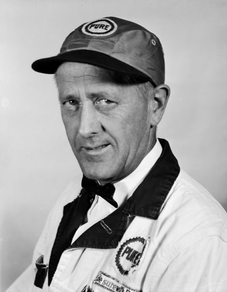 Portrait of a man wearing a Pure Oil uniform.
