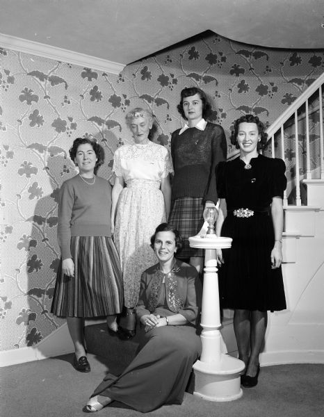 Five alumnae of Alpha Xi Delta sorority wear clothes of their "vintage" in college to a dinner meeting in honor of new pledges. From left, they are: Jean Byrns, Juanita Potter, Lorraina Orchard, Mary Hale, and Helen Kuntz.