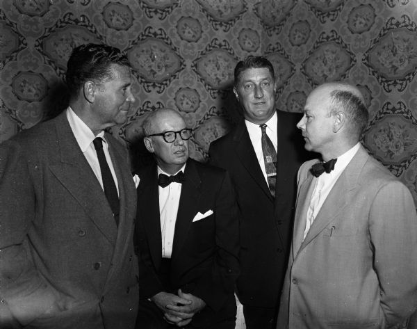 Major league baseball's reserve clause was the topic at a meeting of the Dane County Bar Association. Pictured are: Frank Lane, Chicago White Sox general manager and main speaker; Paul Griffith, president of the bar association; John Rigney, director of the White Sox farm system; and John Gerlach, who introduced the speakers.