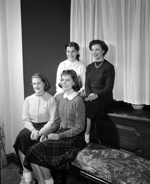 Group portrait of four University of Wisconsin co-eds recently pledged to Gamma Phi Beta sorority, located at 270 Langdon Street. Seated in front, left to right: Dorothy Marling, and Ann Ratcliff. In back are Sarah Reynolds and Anne Sullivan.