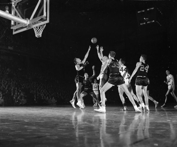 Forward Dick Cable makes a two-handed shot for Wisconsin during the Wisconsin-Missouri basketball game.