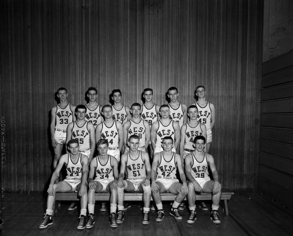 Group portrait of the Madison West High School basketball team.
