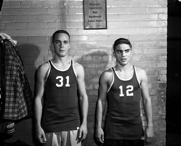 Portrait of two Janesville High School basket ballplayers in what appears to be a locker room.
