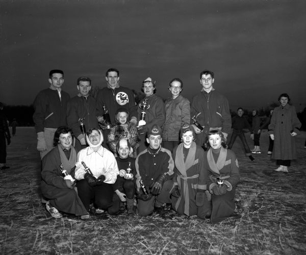 Outdoor group portrait of the Divisional Skating Champions crowned in the Madison Skating Club Meet at Vilas Park.