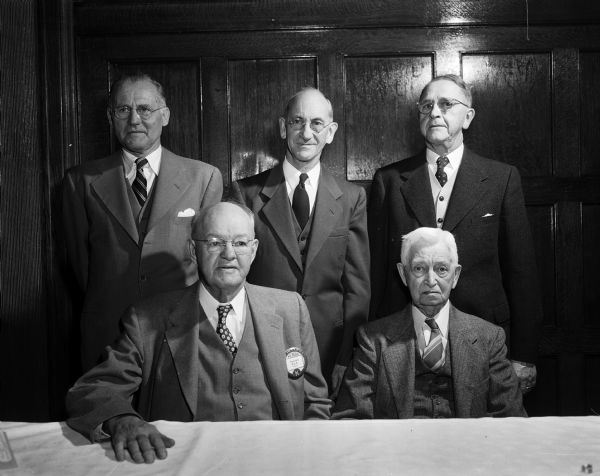 Five charter members of the Madison Kiwanis Club are honored at a special 37th anniversary observance at the Park Hotel. Seated left to right are: Emerson Ela and Harry C. Netherwood. Standing left to right are: Dr. W. Huegel, Jay F. Rose, and Noah J. Frey. The club was formed in January 1917.