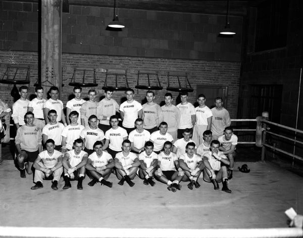 Group portrait of 30 members of the University of Wisconsin boxing squad.