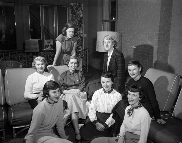 University of Wisconsin sorority members on the Panhellenic Ball committee plan for an annual fundraising event. In front row are Sue Hilgers and Catherine Einum. Others left to right: Shirlee Stafeil, Marilyn Johnson, Mary Ann Strong, Joan Fagan, Elizabeth Burton, and Patricia MacIntyre.