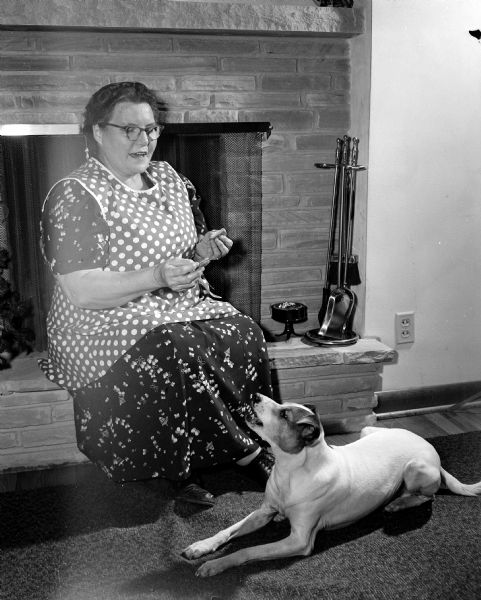 Sandy the talking dog is shown with his owner Lillian (Mrs. Charles) Bran.