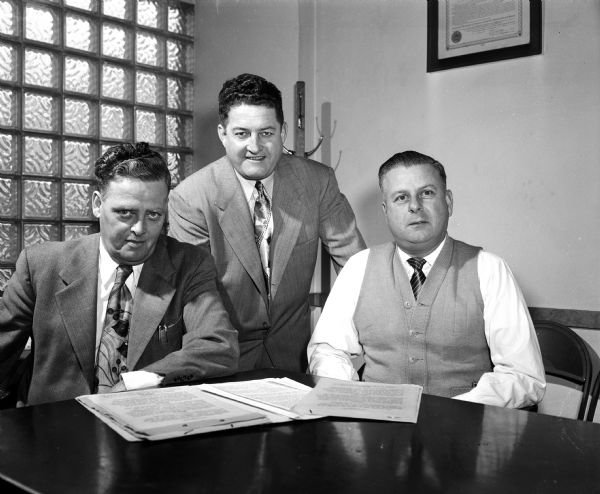 Group portrait of the Teamsters Union Local 442 officers. They are, left to right: Fred Siewert, Secretary-Treasurer; Leslie White, Business Manager; Gordon Bergenske, President.