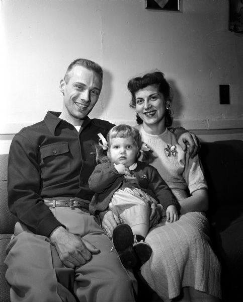 Group portrait of Joyce and Norbert Plewke with their daughter, Pamela, who recently recovered from polio. Mrs. Plewke will participate in the upcoming Mother March, a fundraiser for March of Dimes.