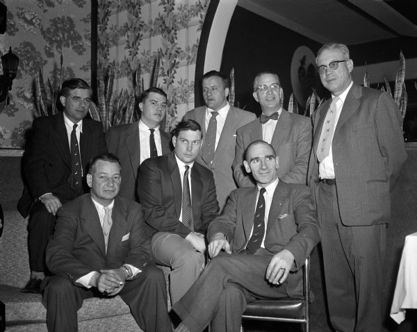 Group portrait of some of the principal members of the Ducks Unlimited Club. Front row, left to right, are: Norman Ott, Milwaukee, state chairman and trustee; Perry Neff, Madison; Angus Gavin, Winnipeg, Canadian general manager. Back row, left to right, are: Hugh Monahan, London, England, secretary of the British Wild Fowlers Association; Tobey Sherry, Madison; Joe Kelly, Milwaukee; Roy Goodlad, Madison; and Stan Johnson, Madison, chairman of the Southern Wisconsin Ducks Unlimited committee.