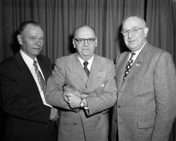 Walter Wachowitz (left) of Waukesha takes over from A.M. Stenz (right) of Stevens Point as president of the Wisconsin State Bowling Association at the annual meeting in Madison. In the center is secretary-treasurer Clarence H. Honen of Milwaukee.