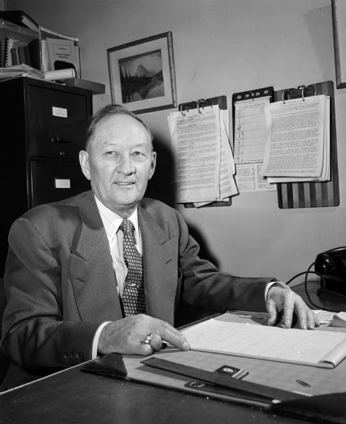 Portrait of Walter Jensen seated at his desk. He was president of the Wisconsin State Council of Carpenters, an independent labor union with 101 locals and 14,000 members.
