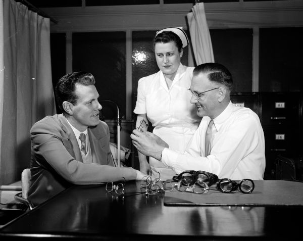 William Farrell (left), Ida Holman, and Robert George at the opening of Gisholt's sight-safety program.