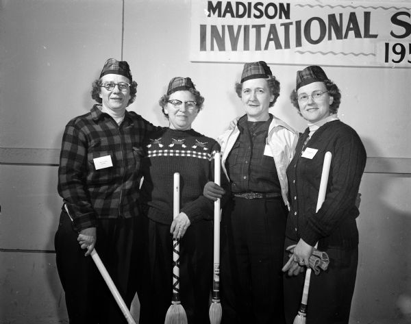 Portrait of Madison's curling team, winner's of the opening bonspiel at Woody Rink. Pictured left to right:  Dorothy Woody, Esther Onstad, Helen Lake, Alice Tennyson.