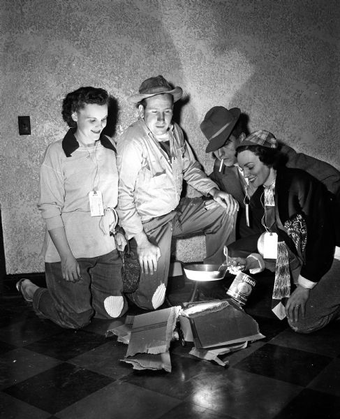 Mr. & Mrs. Robert Clayton (left) and Phil Stark and Virginia Vau Dell take part in the Combo Dance Club's Hobo Jungle Jamboree at the Nakoma Golf Club on March 1, 1954.