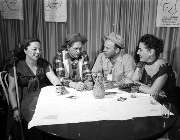 Mary R. Pratt (left), George Pratt, William Kapke, and Loretta Kapke take part in the Combo Dance Club Hobo Jungle Jamboree at Nakoma Golf Club on March 1, 1954.